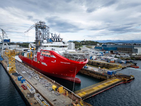 Large commercial vessel in a marine shipyard, representing marine HVAC and cooling-system service for commercial vessels.